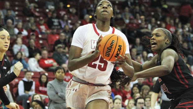 Wisconsin's Serah Williams goes to the basket as Rutgers' Chyna Cornwell defends on at the Kohl Center in Madison, Wisconsin on Saturday January, 27, 2024.